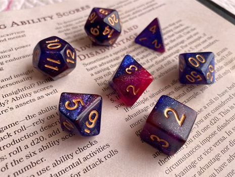RPG dice on a Dungeons and Dragons player's handbook