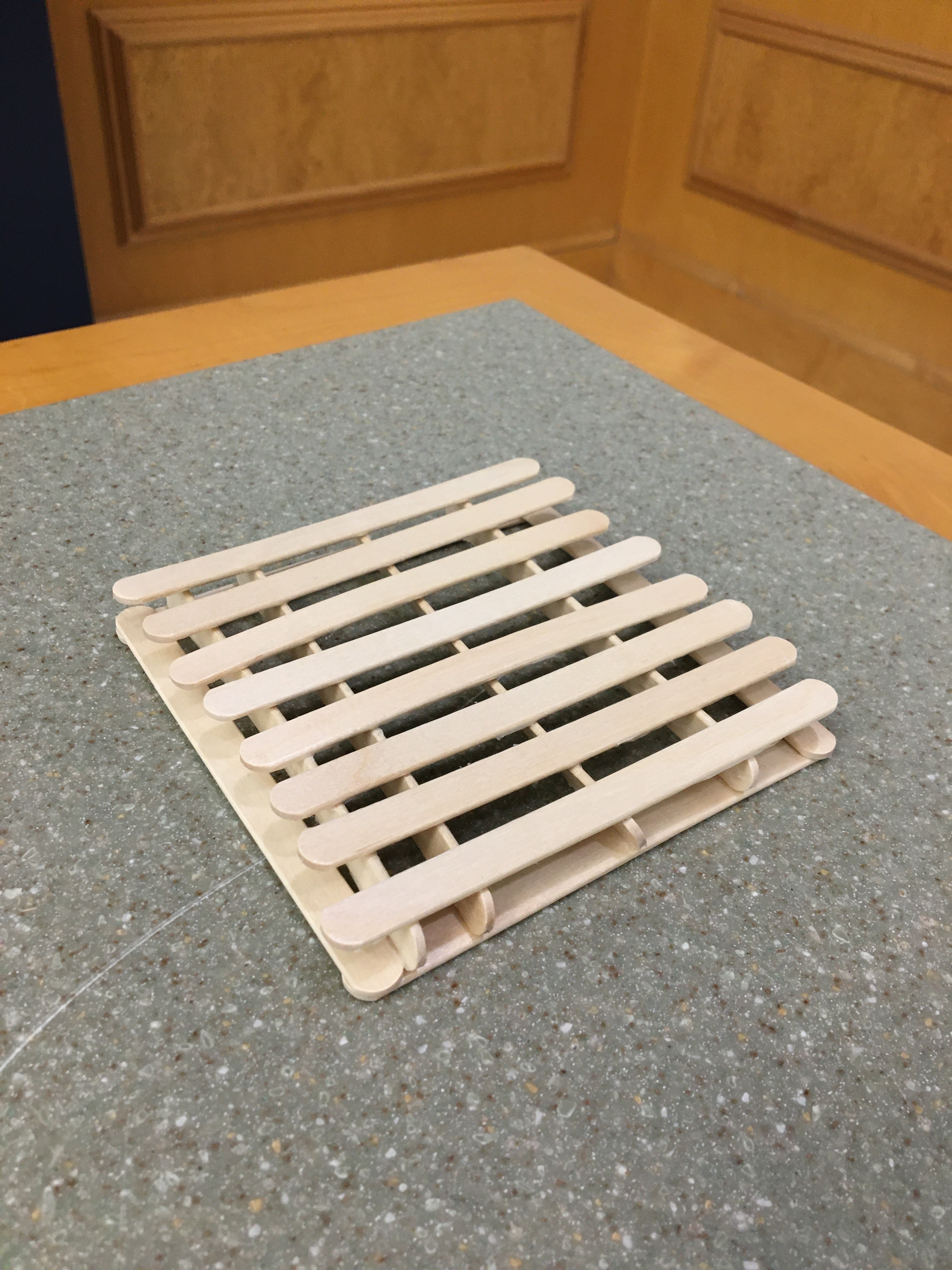 a pallet coaster sitting on a counter