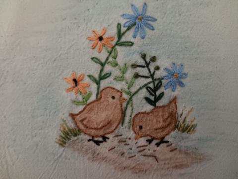 yellow and blue embroidered flowers and ducklings